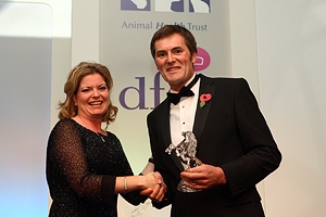 Alison Andrew, Marketing Manager forPetplan presenting Gil Riley with his Award. Credit Matthew Webb.