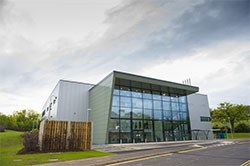 The University of Surrey has officially launched an £11m Veterinary Pathology Centre which will provide a focus for pathology research, education and commercial activity.  Located in the South East of England, the Centre is part of the new School of Veterinary Medicine at the University of Surrey, and one of the UK's largest veterinary pathology centres, offering high-containment post-mortem examination facilities and histopathology. The Centre is staffed by a team of highly skilled, board-certified veterinary pathologists, veterinary investigation officers and technicians, with expertise in farm-animal, equine, exotic and small-animal pathology.    The new building centres on a large Containment Level 2 post-mortem examination room with high ceilings, natural lighting, post-mortem examination tables, biological safety cabinets and integrated cold rooms all served by a powerful winch system.  This means that post-mortem examinations can be performed on a wide range of species.  A viewing gallery overlooks the suite and the latest digital technology can be used to record and stream post-mortem examinations for training purposes.  Professor Roberto La Ragione, Director of the Veterinary Pathology Centre, said: "Veterinary pathology is a growing discipline and its importance has been highlighted in recent disease outbreaks and the important role veterinary pathologists make in drug development.  Helping the farming community to be more effective, sustainable and innovative, the Centre will work with partners, businesses and researchers to address some of the unique challenges faced by the veterinary and scientific community.  "It is the close relationships with our external clinical and scientific partners that enables us to be innovative in our approach to education and training here at the Surrey.  An example of the latter is the use of digital pathology in teaching, research and diagnostics, which was the subject of discussion at the recent launch of the Veterinary Health Innovation Engine (vHive).  "Together with our partners such as the National Physical Laboratory and the 5G Innovation centre, the Centre is at the forefront of the digitalisation of pathology and innovative big data management.  "The Centre offers the opportunity to inspire the next generation of veterinary pathologists and complements the centres of excellence that already exist in other vet schools and research institutes."